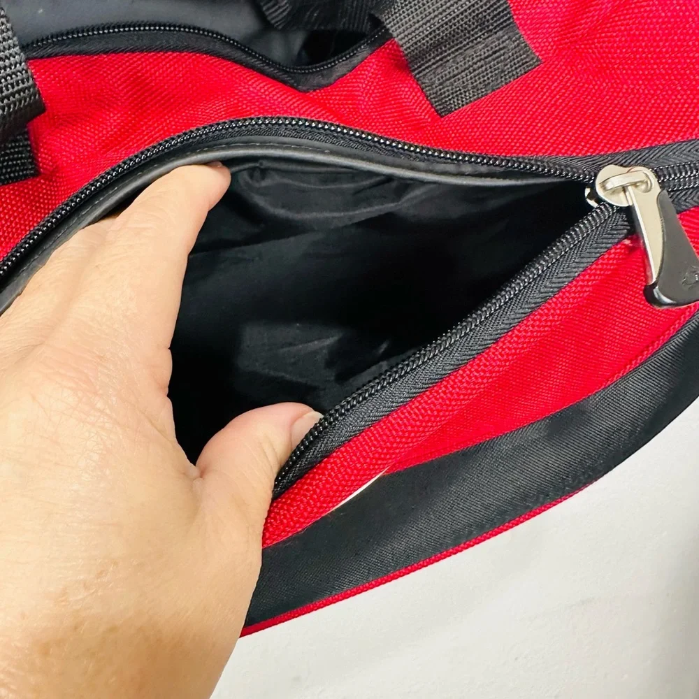 American Tourister Red and Black Duffel Bag